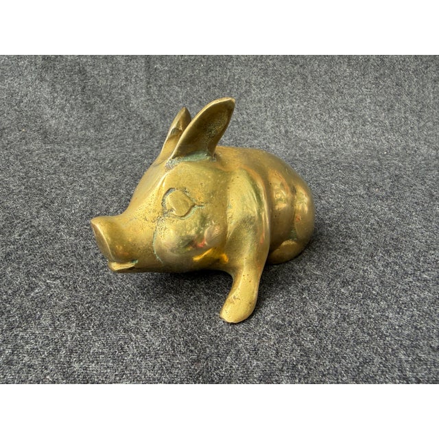 Small vintage solid brass lounging pig figure. Pig is leaning slightly to his right. No marks. He measures approximately 4...