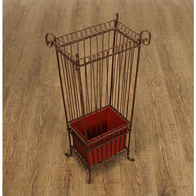 Decorative Vintage Umbrella Stand Crafted from Wrought Iron with Delicate Scrollwork and Wire Construction. The Tall...