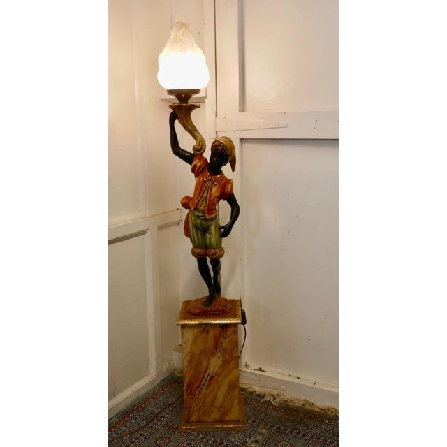 A magnificent venetian figural floor lamp a charming italian carved wooden figural floor lamp the figure is carved in soft...
