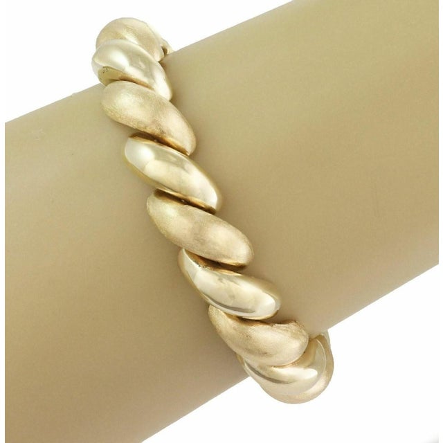 The San Marco Italy 14k Yellow Gold Macaroni Link Bracelet is a vintage piece of fine jewelry crafted in Italy. This...