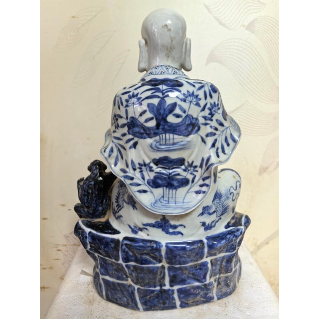 W-22cm,H-32cm This hand-carved blue and white porcelain statue depicts The Eighteen Arhats, a traditional Chinese Buddhist...