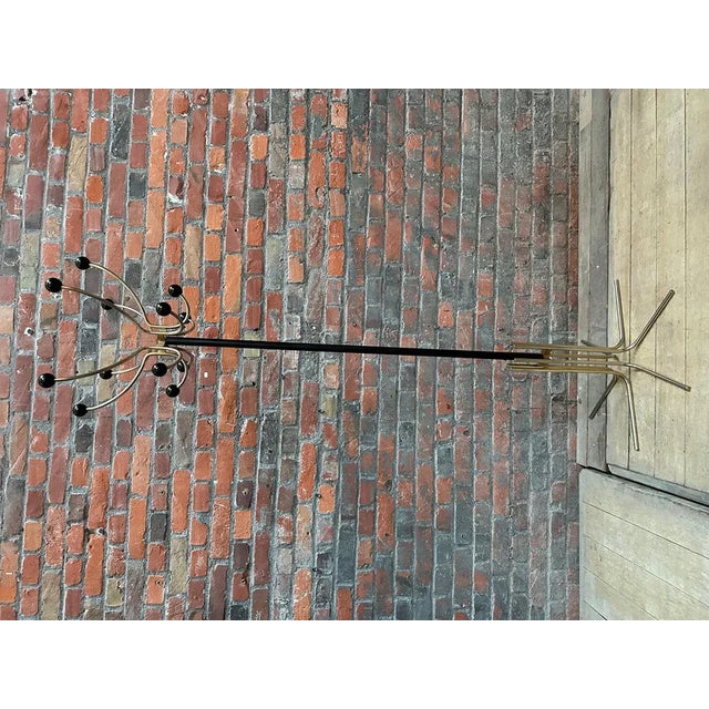 Vintage “Parrot” coat rack in metal Very stable, 12 black lacquered balls in perfect condition. As pretty as it is...