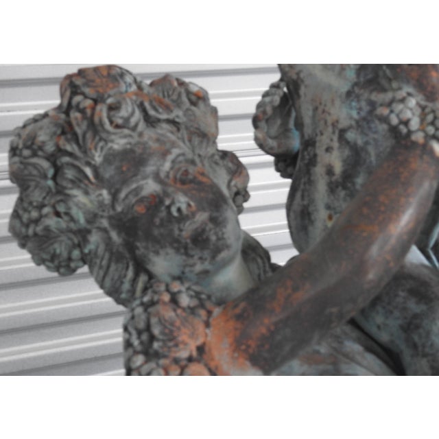 Two women with their children make up this stunning patinated bronze from the Art Deco era. Clusters of grapes adorn them...