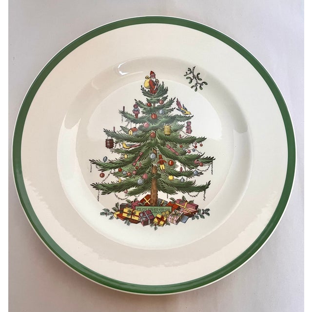 Quintessential holiday tableware. Set of six Spode Christmas Tree dinner plates. Made in England. The plates measure 10...
