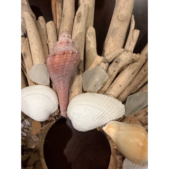 A wonderfully textural coastal wall accent handcrafted from an abundant arrangement of naturally weathered driftwood,...