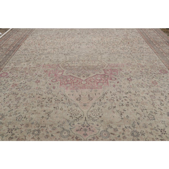 This 13x20 antique Sivas rug is an extremely rare oversized rug of its period—made with hand-knotted wool in Turkey circa...