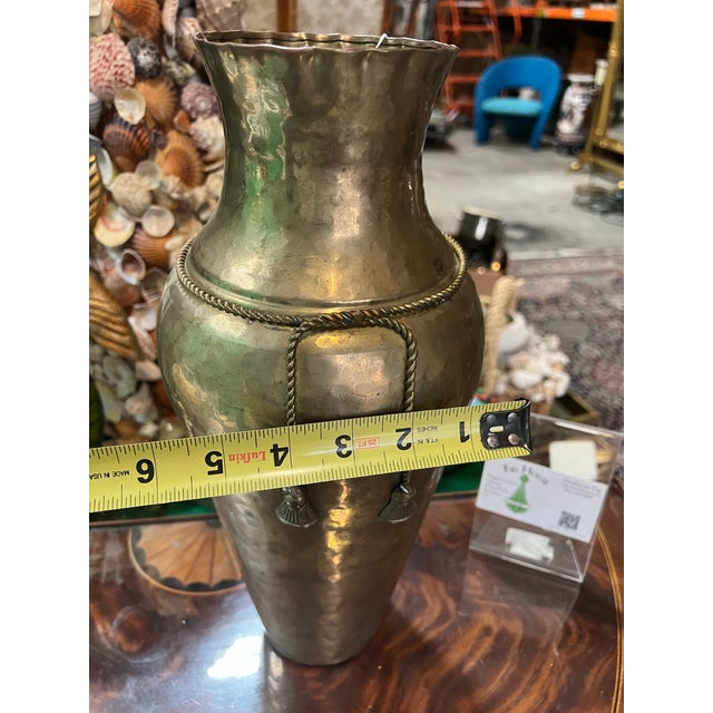 Up for consideration is a beautiful vintage brass vase with rope and tassel details. This would look lovely in your home...