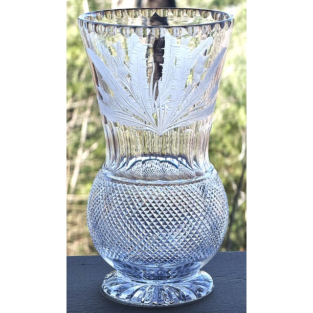 This is the 10” flower vase in the Thistle Cut pattern by Edinburgh Crystal, a Scottish glass company that can be traced...