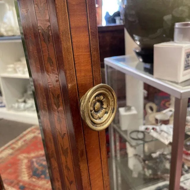 Edwardian, George III Style mahogany and inlaid cheval mirrors, having broken swan inlaid pediment with central and side...