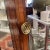 Edwardian, George III Style mahogany and inlaid cheval mirrors, having broken swan inlaid pediment with central and side...