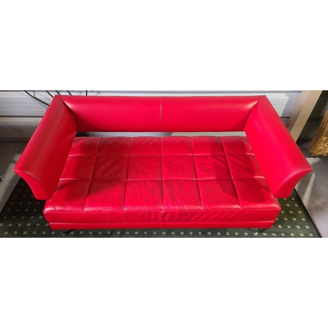 Living room 2-seater sofa and armchair in Siam red leather model Hydra Castor by architect designer Luca Scacchetti and...