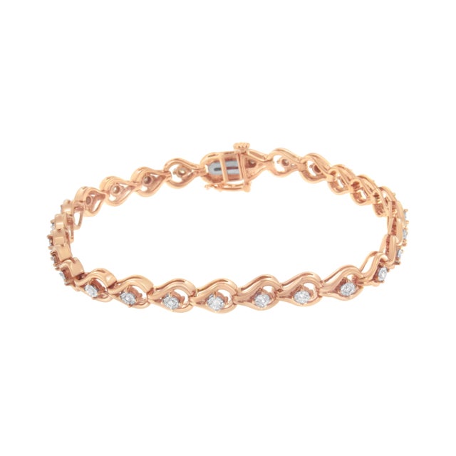 Elegant and timeless, this gorgeous sterling silver link bracelet features 0.29 carat total weight of round, promo quality...