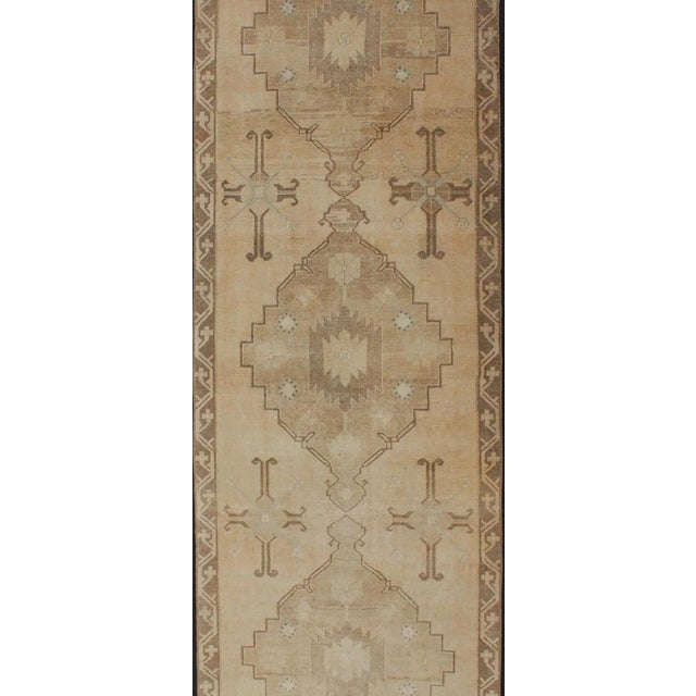 Tribal Vintage Turkish Oushak Runner Neutral and Warm Colors With Tribal Medallions For Sale - Image 3 of 13
