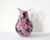 A vintage, mid-century Italian, Murano art glass pitcher, with an abstracted pink and black millefiori design and a clear...