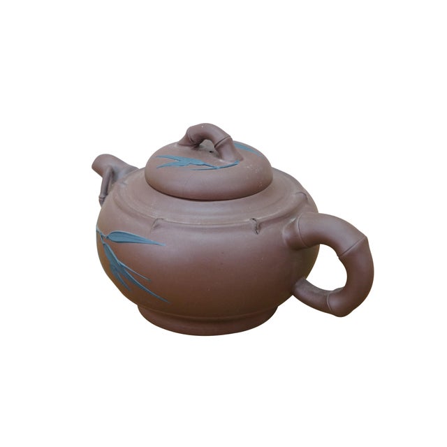 Vintage Chinese Yixing clay tea / coffee pot with a bamboo leaf motif. It is made from purple clay (zisha), a type of...