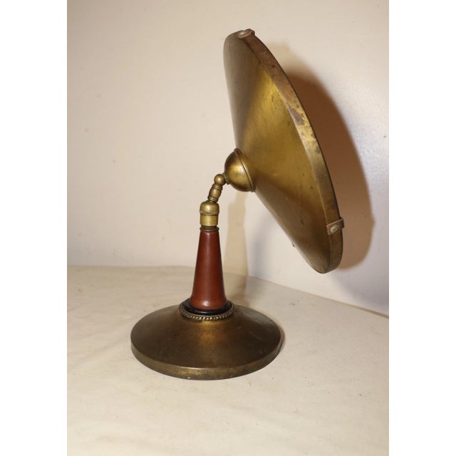 Up for sale is a very nice quality antique industrial style table mirror. It's made of a lacquered brass and has a teak...