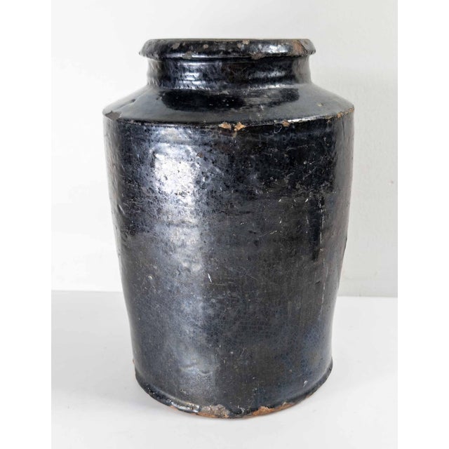 We are selling this great rustic looking black glazed storage jar. This jar has nice utilitarian form with simple shape...