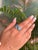 This elegant sterling silver ring highlights the beauty of two brilliant round blue topaz gemstones, weighing a total of...