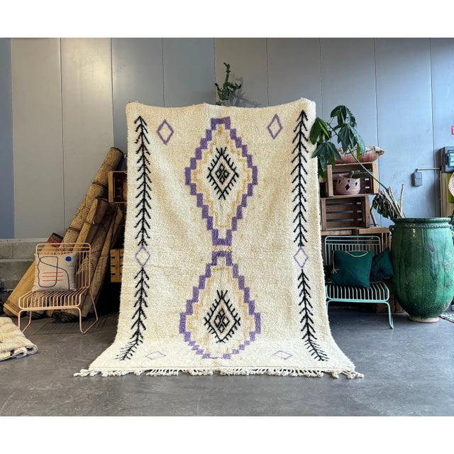 A refined Beni Ouarain rug handwoven in the Atlas Mountains using thick, high-quality natural wool. This piece features a...