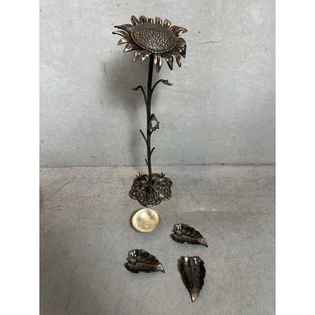 Vintage bronze ashtray in the shape of a sunflower. Marked: S. Agudo. The top of the sunflower functions as a lid, which...