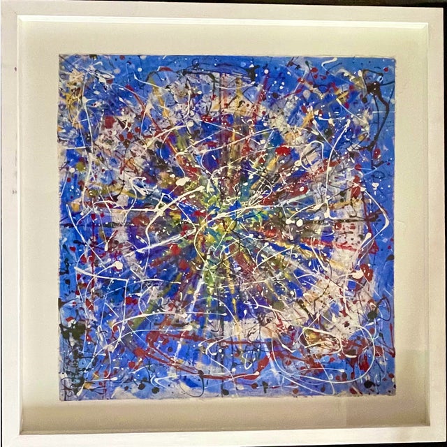 A mixed media splatter painting on linen laid down on board. White wood frame, behind glass Signed and dated verso. Framed...