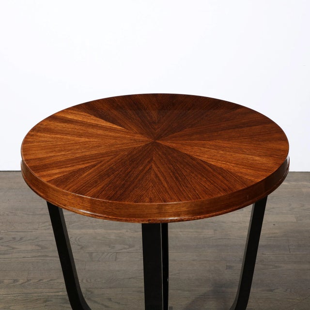 This stunning Art Deco Gueridon table was realized in France circa 1935. It features a four-pointed base in bookmatched...