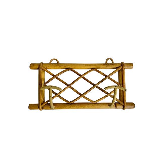 Vintage French double coat hat rack. Metal hooks with bamboo lattice form back. Sourced in France.