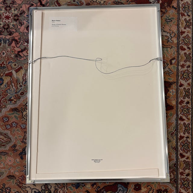 Framed and matted drawing titled “Study of Seated Woman” by Italian artist Mario Fallani. 1961-1962.