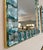 Striking pair of handmade Italian wall mirrors, produced in Italy, in Murano. Each mirror features a frame composed of...