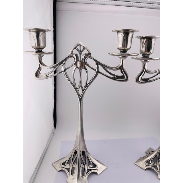 Pair (2) impressive art nouveau candlesticks pewter, silver-plated this elegant candlestick is a famous "art nouveau"...
