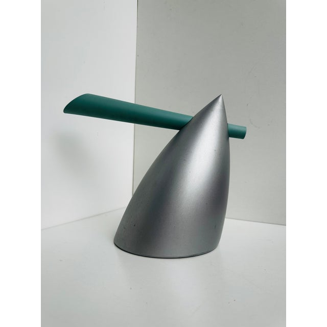The Hot Bertaa kettle was designed by Philippe Starck for Alessi in 1990. The body is made of brushed aluminum, and the...