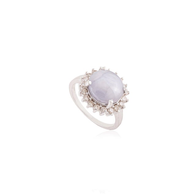 This striking french vintage-inspired cocktail ring features one cabochon star sapphire totaling 4.63 carats, set in 14K...
