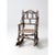 An antique Adirondack children’s rocking chair showcasing rustic folk art charm. Crafted from bentwood twigs, it features...