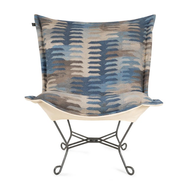 Infused with a playful palette of blues, this fabric features a modern, stepped pattern that brings an artistic energy to...