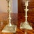 An unusual pair of polished solid cast brass candlesticks, English, ca. late 18th/early 19th century, in a style evoking...