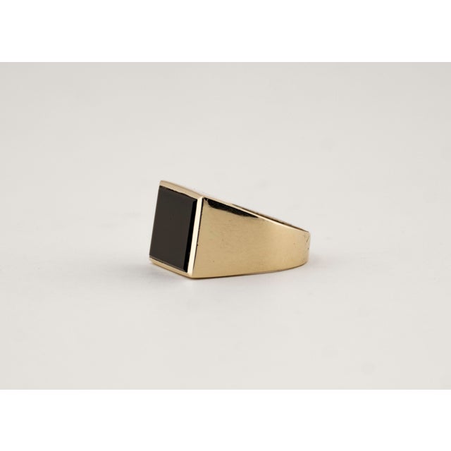 This striking ring from the 1970s stands out with its sculptural and geometric form. Crafted from solid 14k yellow gold,...