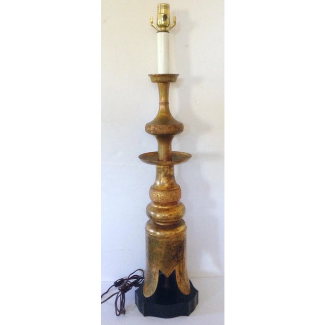 Frederick Cooper James Mont style lamp, having a single light above a Moorish style base. He created many lamps during the...