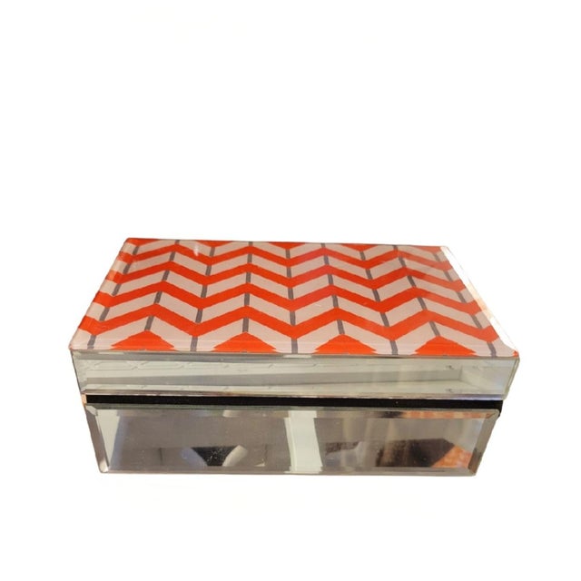 A beautiful orange and white Chevron design glass storage box. This is a very special box with glass chevron pattern. The...