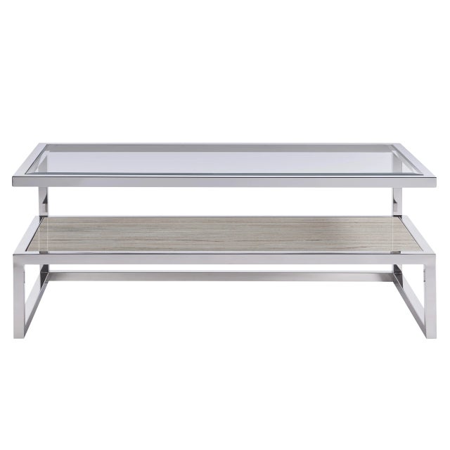 The Parade Cocktail Table with Stone Shelf features the perfect pairing of a beveled clear glass top with an open stone...