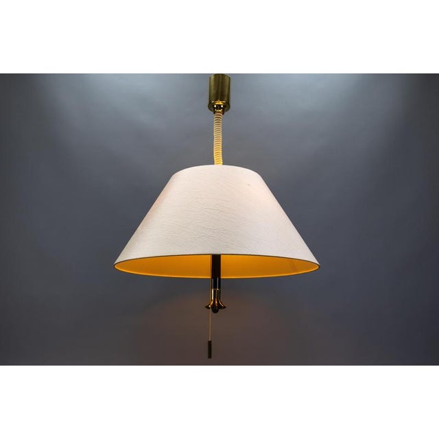 Large adjustable-height five-light pendant lamp with a fabric lampshade, Germany, circa 1980. Made in the Scandinavian...