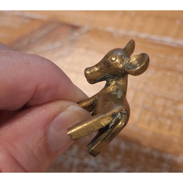 Up for sale is an authentic, highly collectible vintage mid-century modern miniature brass calf / baby cow sculpture...