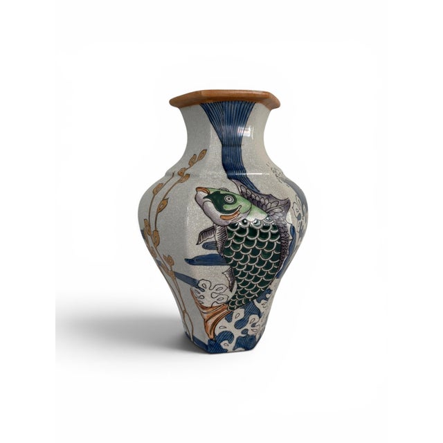 This is a hexagonal ginger jar canister vase by Seymour Mann features a traditional Chinese-style fish and algae pattern...