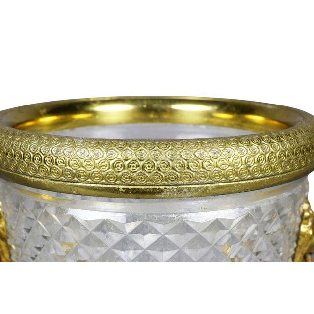 Engine turned gilt bronze rim and lions head side mounts, diamond cut cylindrical tapered body.