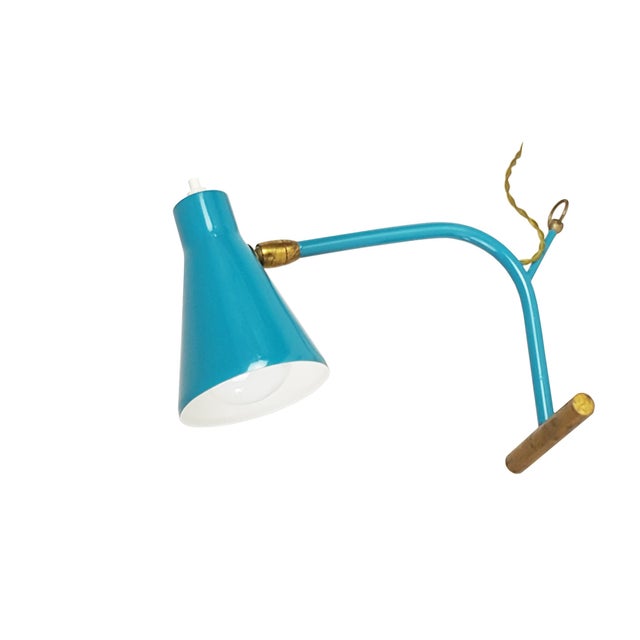 Pair of table lamps made from brass and painted metal with adjustable cone. Due to a small brass ring, the lamps can also...