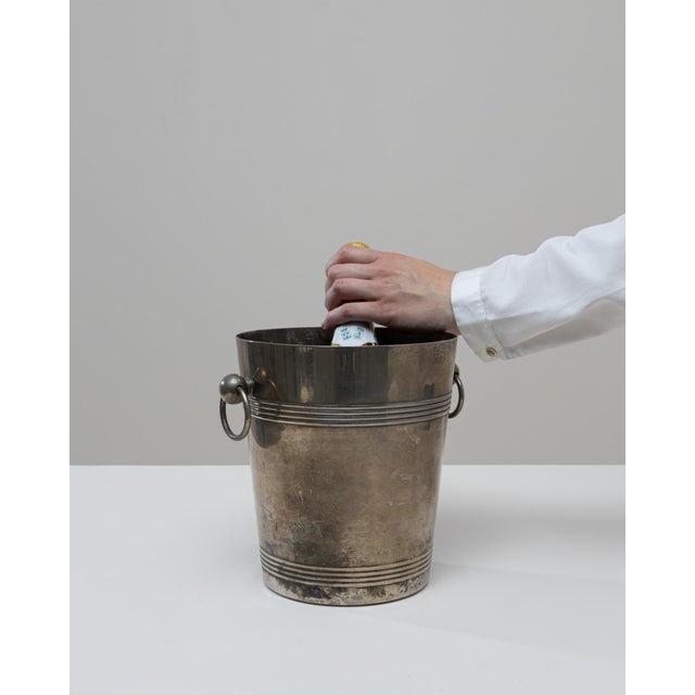 A 20th Century French silver-plated champagne bucket distinguished by its understated elegance and beautifully aged...