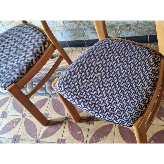 Elegant and finely constructed pair of Danish "Morten" dining chairs by Niels Koefoed, the seats covered with a...