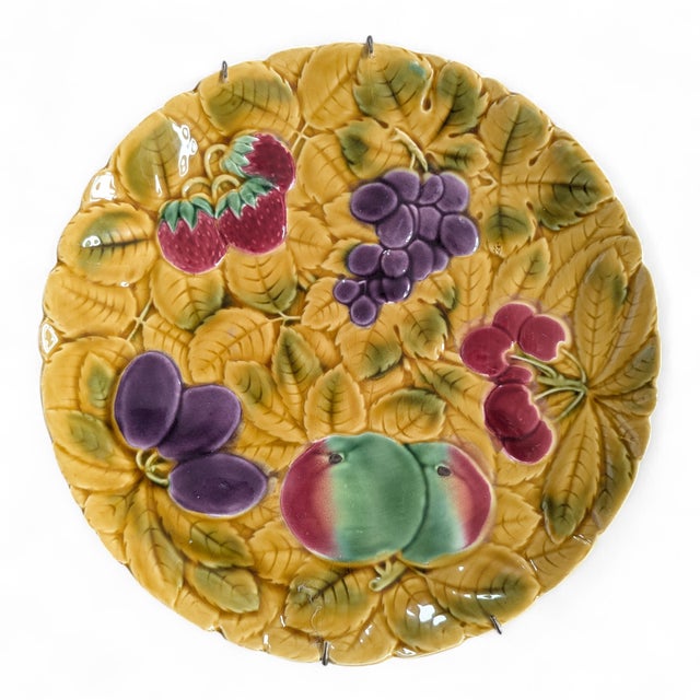 French Barbotine Majolica Plate featuring Grapes, Strawberries, Cherries, Plums, and Peaches Stamped "Made in France" on...