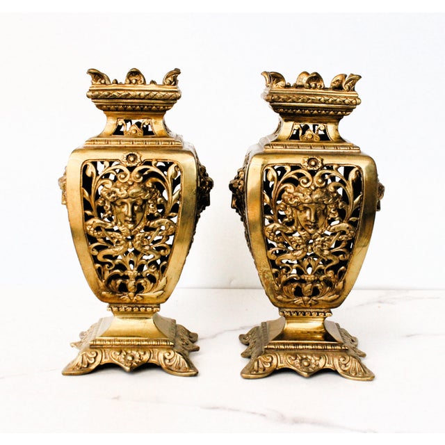 Elegant pair of 19th Century ormolu reticulated vases, crafted in the Louis XVI manner. The vases are cast from bronze and...