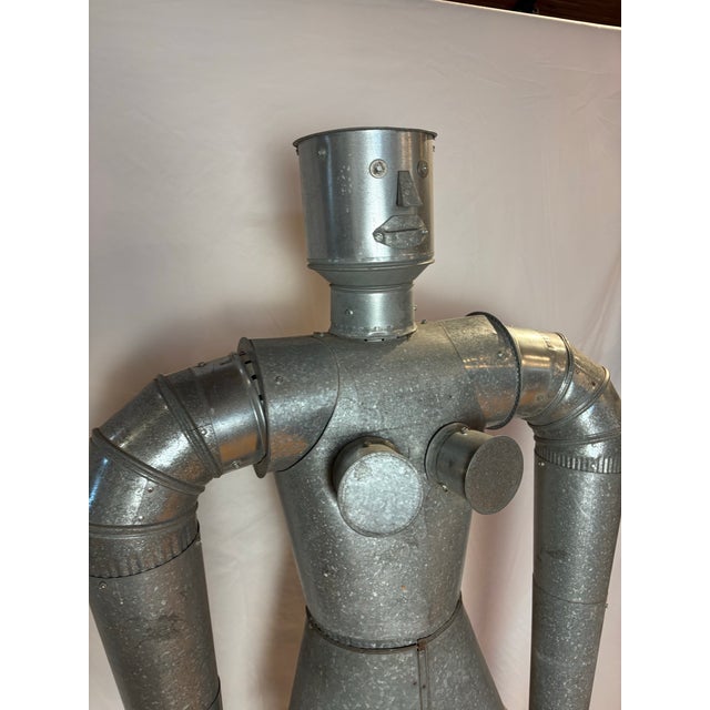 Here's some real industrial whimsy for your space! Large-scale robot sculpture, meticulously constructed from galvanized...
