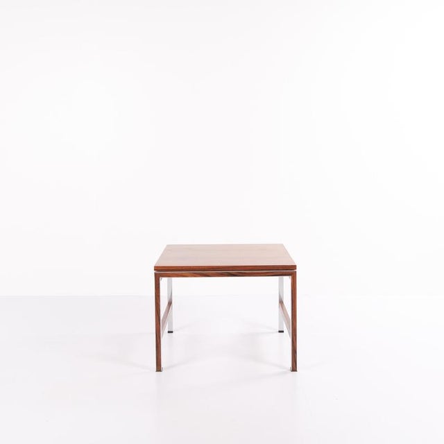 Side or lamp table from the 1960s, made of rosewood with aluminium details. Classic Danish design suitable as a coffee...